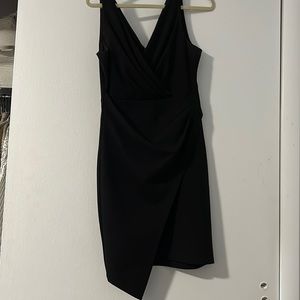 Asymmetric black dress. Spaghetti strap.